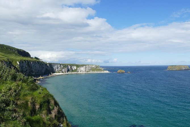 2-Day Northern Ireland Rail Tour: Belfast, Antrim Coast, and Giant's Causeway - Dunluce Castle photo stop: quick legs, big views, real trade-offs