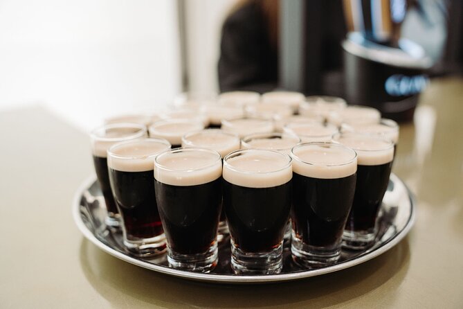 Dublin Jameson Distillery and Guinness Brewery Guided Tour - The quick tram ride through Smithfield: getting from whiskey to beer
